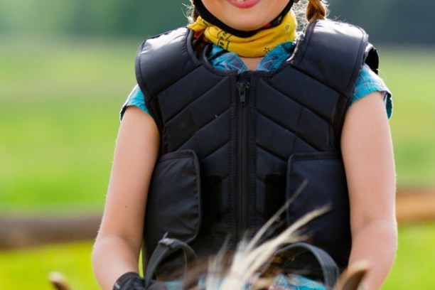 a close up of a child wearing a helmet